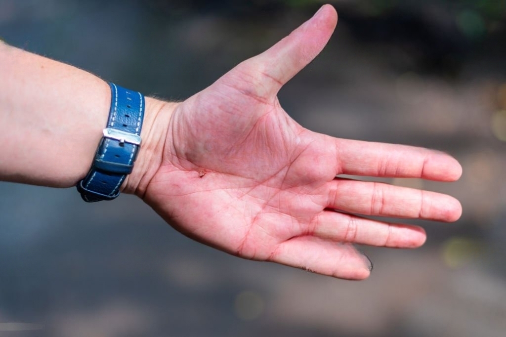 hand with watch blue